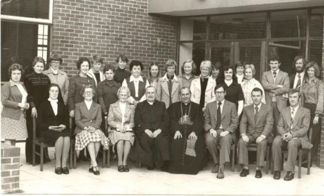 The late Canon Francis McLarnon, Parish Priest and the original staff of St. John the Baptist P.S. photographed with the late Cardinal Tomas O'Fiaich at the blessing and official opening of the school in 1975.